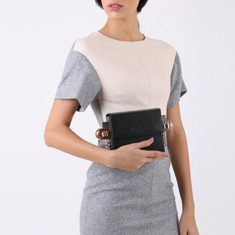 Box clutch with a removable strap